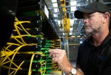 technician installing fibre optic cables