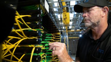 technician installing fibre optic cables