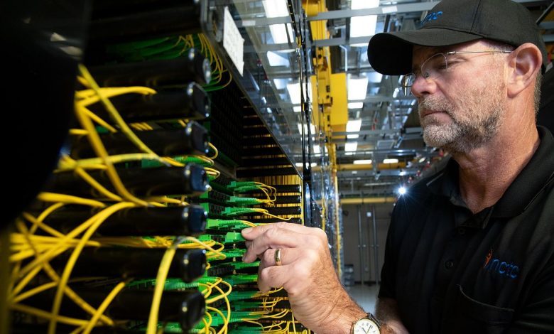 technician installing fibre optic cables