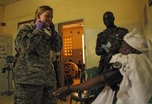 nurse checking a patient's blood pressure