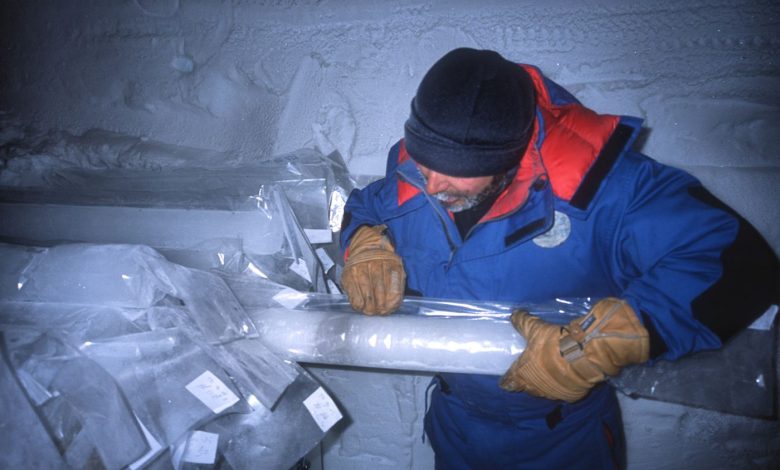 A scientist examining a drilled ice core sample