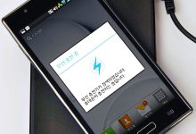 A smartphone snapped onto a magnetic wireless charger