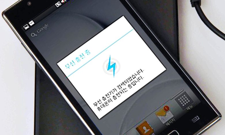 A smartphone snapped onto a magnetic wireless charger